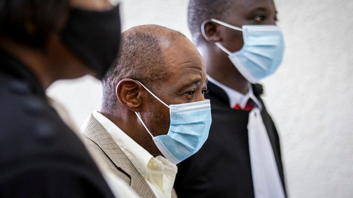 Paul Rusesabagina, center, who inspired the film "Hotel Rwanda" for saving people from genocide, appears at the Kicukiro Primary Court in Kigali, Rwanda, on Monday, Sept. 14, 2020. Rusesabagina became famous for protecting more than 1,000 people as a hotel manager during Rwanda's 1994 genocide and was awarded the U.S. Presidential Medal of Freedom in 2005, but Rwandan authorities accused him of supporting the armed wing of his opposition political platform, which has claimed responsibility for deadly attacks inside Rwanda.