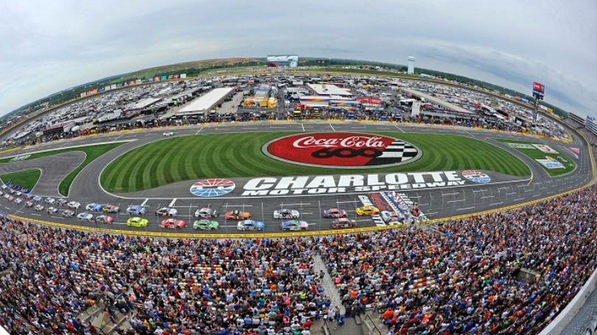 In this May 27, 2018, file photo, the field takes the green flag to start the NASCAR Cup Series auto race at Charlotte Motor Speedway in Concord, N.C. The governor of North Carolina says NASCAR can go forward with the Coca-Cola 600 at Charlotte Motor Speedway at the end of May so long as health conditions do not deteriorate in the state. Gov. Roy Cooper said Tuesday he and state public health officials have had discussions with NASCAR and the speedway regarding its safety protocols for staging a race without spectators. Cooper said the state offered input on NASCAR’s plan, but he believes the race can go forward on Memorial Day weekend for the 60th consecutive year. (Source: AP Photo/Mike McCarn, file)