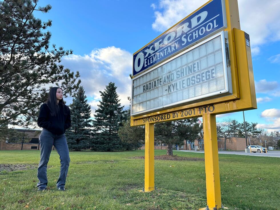 Kylie Ossege stands outside Oxford Elementary School Saturday, Nov. 11, 2021, in Oxford...