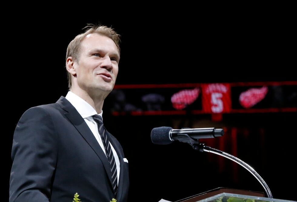 Former Detroit Red Wing Nicklas Lidstrom addresses the audience during the retirement of his...