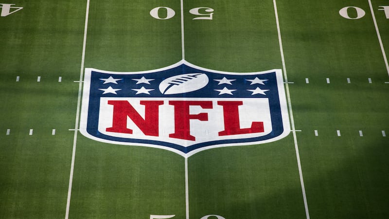 FILE - This photo shows the National Football League logo painted on the field prior to the...