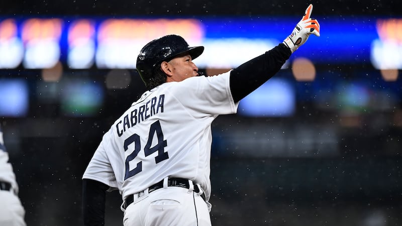 Detroit Tigers' Miguel Cabrera gestures after hitting a home run off Kansas City Royals...